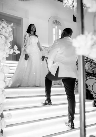 Wedding photo: bride groom grand staircase black white