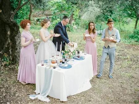 Wedding photo: small wedding dinner under olive trees
